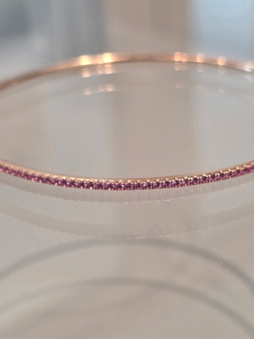 Gorgeous 14 kt gold and genuine pink sapphire 7" bangle bracelet